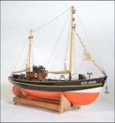 A good vintage model boat ' Elke Finkenwerder '. German ship, on stand.