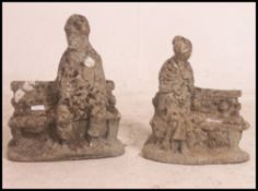 A pair of well weathered reconstituted stone garden ornaments,