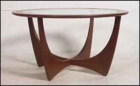 A retro 1970's 20th century G Plan - ' Astro ' teak coffee table with circular glass inset top with