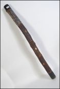 A traditional mid 20th century Aboriginal / Australian didgeridoo with painted animal and
