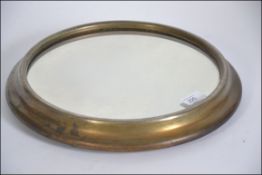 A vintage mid century brass and mirror glass wedding cake stand.