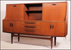 A retro 20th century teak wood display / sideboard. 121cm high x 188cm wide x 46cm deep.