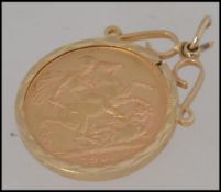 An early George VI 1903 full gold sovereign with George and the Dragon back set within a 9ct