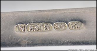 A Danish silver hallmarked serving spoon with oyster shell bowl being marked for Magnus Aase.