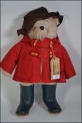 An original vintage Gabrielle designed Paddington Bear, with tag and original welly boots.