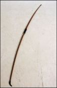 A 20th century sports Longbow, with leather grip,