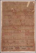 A framed and glazed George III era needlepoint numerals and alphabet sampler.