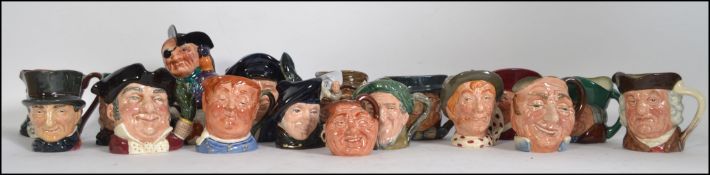A large collection of Doulton character mugs in the small form .