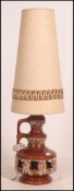 A good 1970's retro West German fat lava table lamp in brown glaze with original tall conical shade