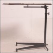 A Victorian 19th century mahogany reading table lecturn raised on a splayed cast iron base with