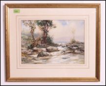 Bartram Hiles (1872-1927) England. A snow swept winter country scene with trees and rocks.