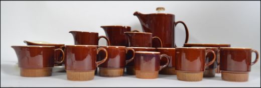 An extensive retro Poole coffee service to include pots, trios,