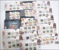 A collection of Royal Mail Mint Stamp presentation packs all pertaining to the Beatles 16 packs in