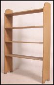 A tall 20th century open window large solid pine bookcase shelf.