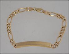 A 9ct gold identity bracelet on a Figaro chain and stamped to the clasp 375. 5.6g 20.