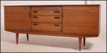 A retro vintage teak side board in the Danish manner .