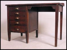 A mid century Air Ministry type solid oak clerks desk having open kneehole recess flanked by a