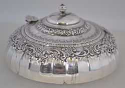 An embossed and decorative silver powder pot bearing Sheffield hallmarks for James Dixon & Sons,