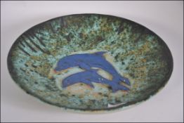 A 20th Century Dolphin Charger by Tony Smither of Yelverton, Devon,