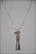 A silver ( Stamped 925 ) snake necklace 44cm long with a silver ( stamped 935 ) pendant of a young