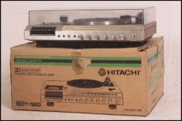 A retro 1970's Hitachi SDT - 120 record deck having integrated tape and radio function all