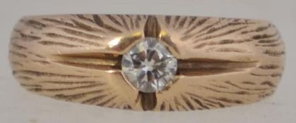 A 1970's designer 9ct gold and diamond ladies single stone band ring.