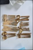A collection / set of nearly new Bronze cutlery service, to include knives, forks,
