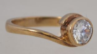 A 9ct gold and cz single stone solitaire dress ring.