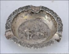 A continental silver hallmarked pin dish ashtray cast in relief with central diorama of tavern