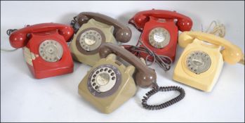 A collection of 5 vintage BT ring dial telephones to include various colours such as red, grey,