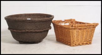 A vintage weave oyster - washer womans basket of round form dating to the early 20th century