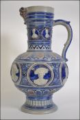 Westerwald: A large 19th century German Jug decorated with a mask to the spout,