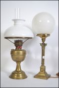 A late 19th century brass Cornelian column lamp with milk glass shade converted to electric
