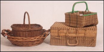 A small stack of vintage whicker items to include brackets x 3 and a vintage picnic hamper