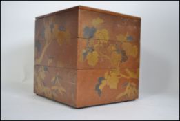A Japanese laquered 3 tier foot box - maki-e jubako.
