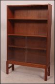 A retro 20th century teak wood bookshelf having four adjustable shelves,