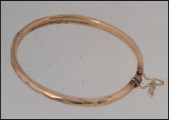 A 9ct gold hallmarked ladies bangle ( see illustrations ) bearing Birmingham hallmarked date