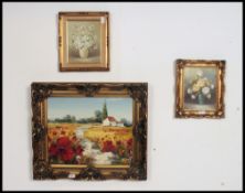 Three framed oil paintings of still life studies each painting being of floral content by different