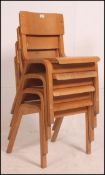 A set of 4 vintage ply panel bentwood school - stacking hall chairs raised on bentwood angular legs