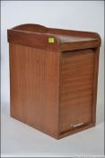 A mid 20th century tambour fronted stationery desk tidy originally from the Wills factory,