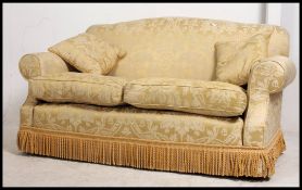 A good quality contemporary Chesterfield sofa settee upholstered in a gold chenille fabric with
