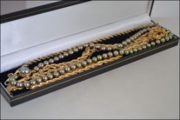 A collection of necklaces and a 9ct gold bracelet to include a simulated pearl necklaces