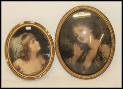A vintage early 20th century oval gilt framed print of a maiden having fish eye glass together with