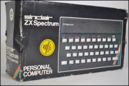 A vintage Sinclair made ZX Spectrum games console, within the original box.