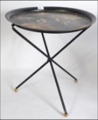 A 20th century retro atomic and oriental style metamorphic folding occasional table on tripod