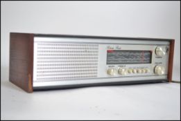 A vintage Roberts radio model RM 40 having a chrome fascia and teak wooden ends