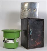 An unusual dutch enamel paraffin burner by Origineel Putter together with a black metal locker