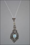 A silver and marcasite art deco style necklace with central opal