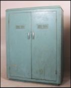 A stunning vintage farmhouse larder cabinet having full length double doors with a full shelved