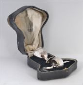 A silver hallmarked cased christening set comprising egg cup,